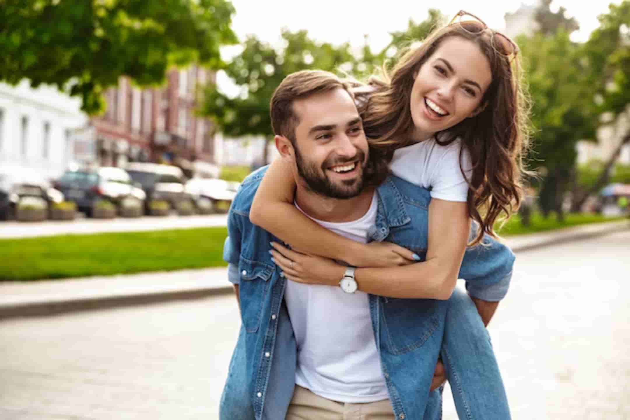 Young-couple-smiling-about-their-medical-card